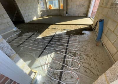 Underfloor heating screed in progress