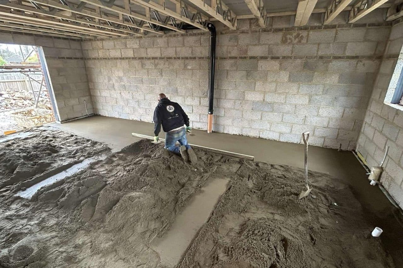 Floor screed contractor at work on a new build in Desborough
