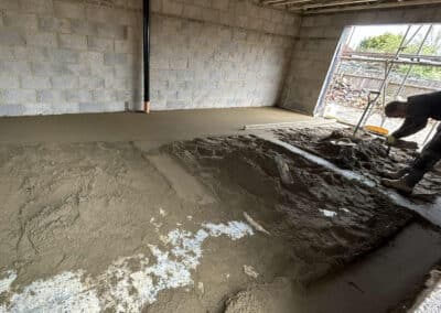 Floor screed contractor at work on a new build in Desborough