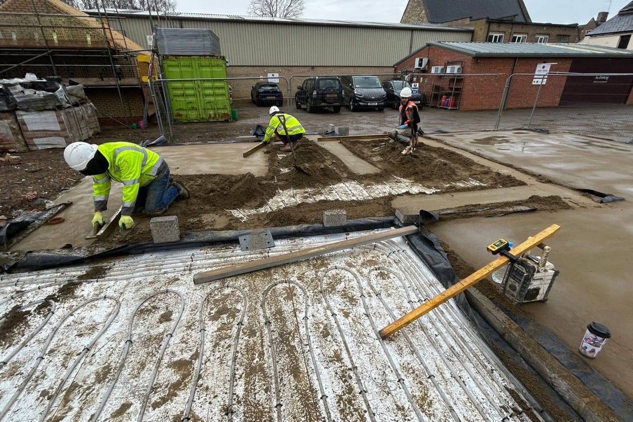 Floor screeding contractors working on a new build plot in Towcester