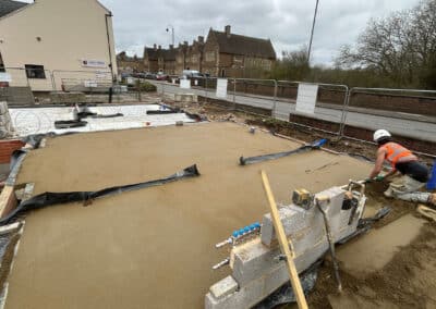 Floor screeding contractor working on a new build plot in Towcester