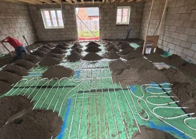 Floor screed over underfloor heating at new bungalow in St James, Northampton