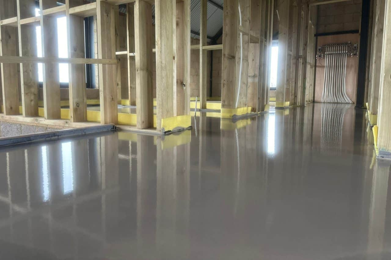 Self levelling compound at an underfloor heating installation in Peterborough