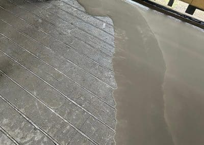 Self levelling compound at an underfloor heating installation in Peterborough