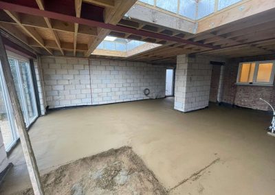 Newly installed floor screed surface at a home extension project