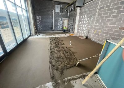 Newly installed floor screed surface at a retail unit