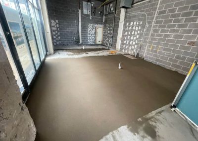 Newly installed floor screed surface at a retail unit