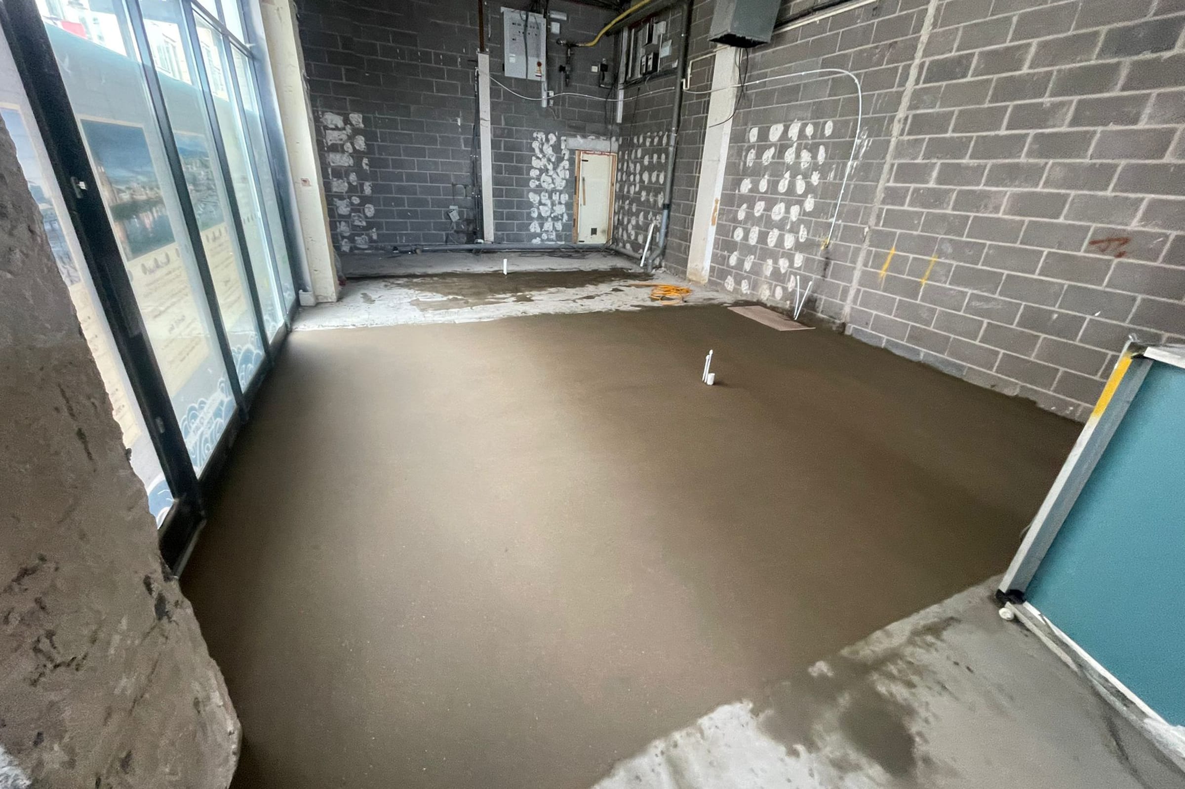 Newly installed floor screed surface at a retail unit