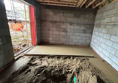 Partially installed floor screed at a new property
