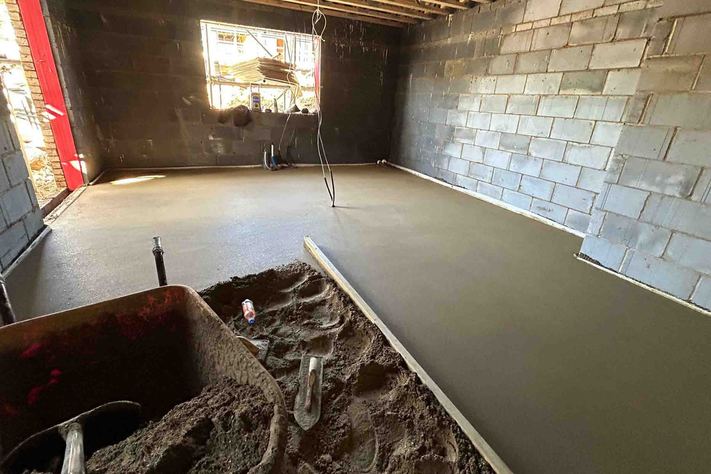 Partially installed floor screed at a new property