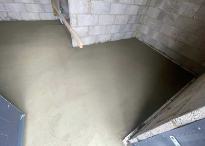 Newly installed floor screed surface at a home extension project