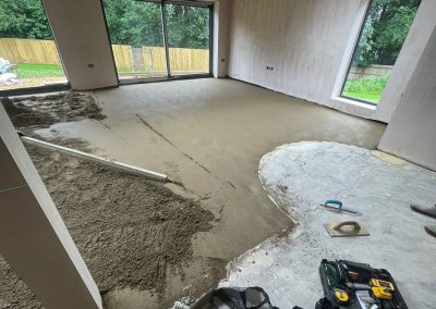 Newly installed floor screed surface in home extension project