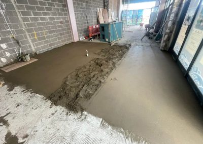 Newly installed floor screed surface at a retail unit