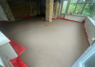 Newly installed floor screed inside a home extension in The Cotswolds