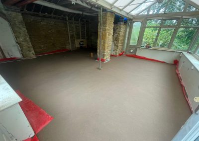 Newly installed floor screed inside a home extension in The Cotswolds