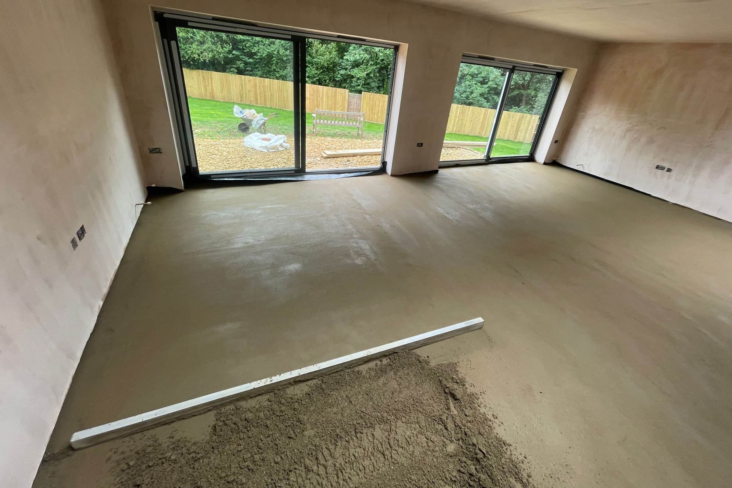 Floor screed at a home extension in Kettering Newly installed floor screed surface in home extension project