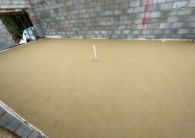Newly installed floor screed surface in home extension project