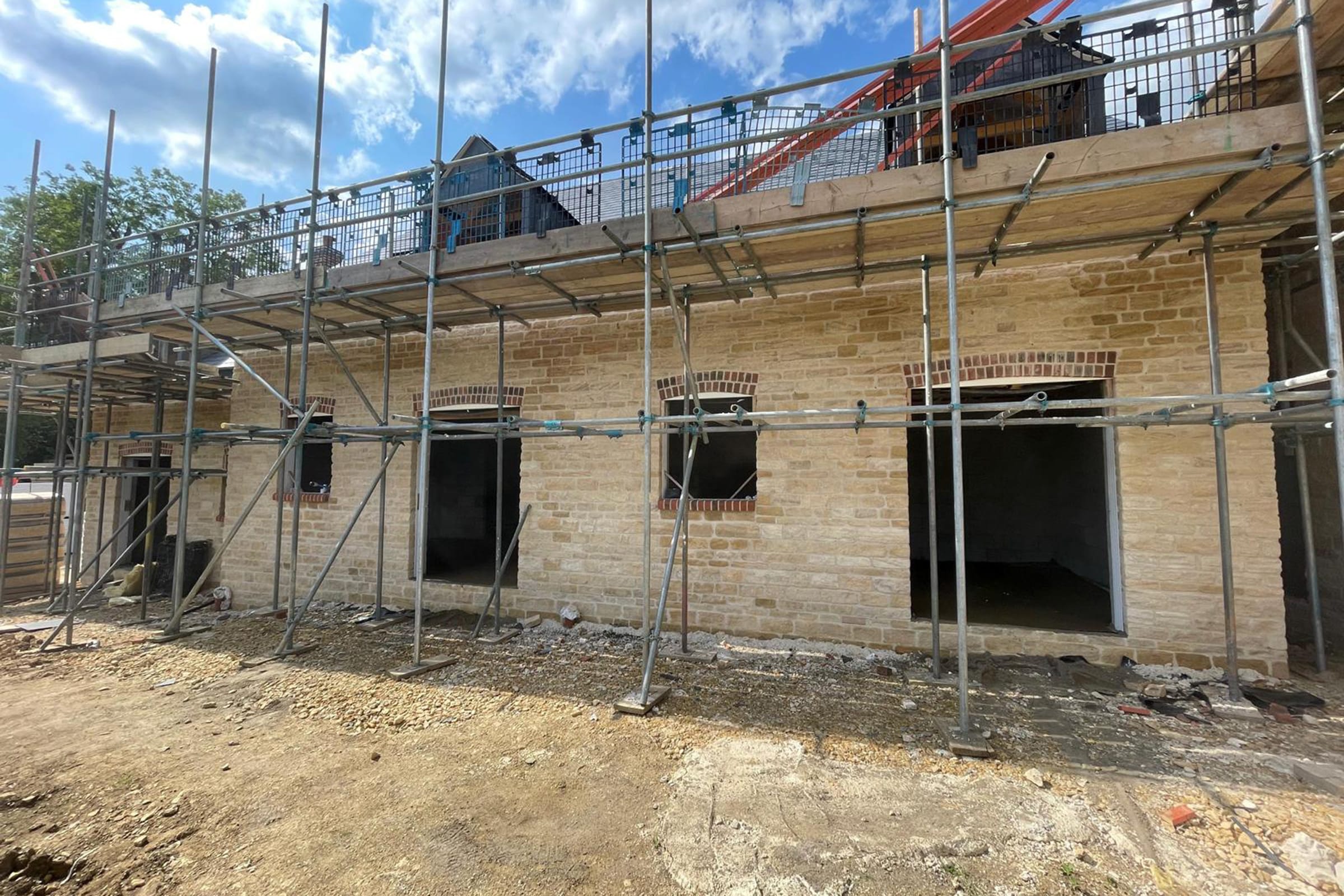 Floor screeding at a new build property in Glapthorn, near Oundle Exterior of a new build property with scaffold