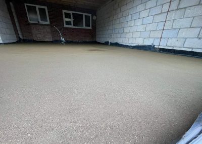 Newly installed floor screed surface at a home extension project