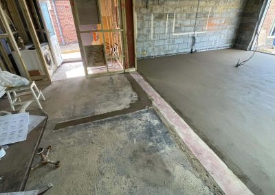 Newly installed floor screed surface in home extension project
