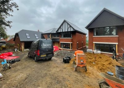 Liberty van outside a building site with new properties