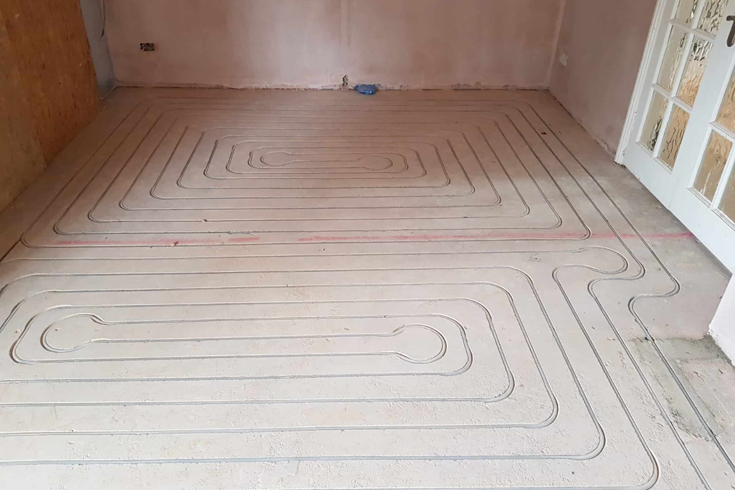 Routered underfloor heating screed installation