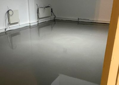 Worker installing latex screed