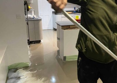 Newly installed latex floor screed surface in a kitchen