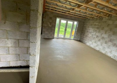 Newly installed floor screed surface at a home extension project
