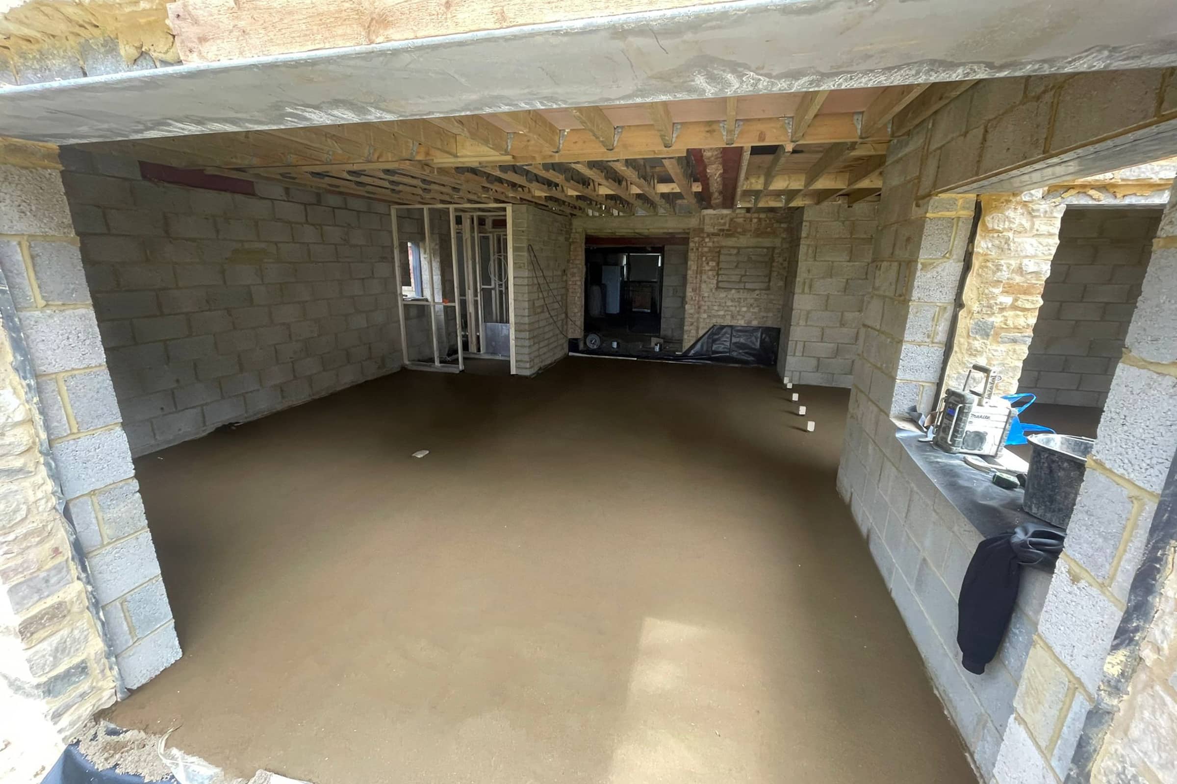 Newly installed floor screed inside a new build property in Olney