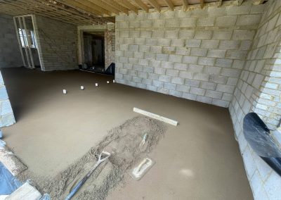 Partially installed floor screed inside a new build property in Olney