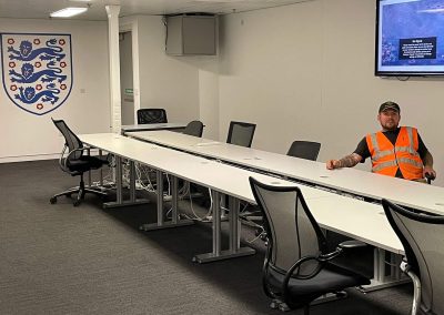 Worker in conference room at Wembley Stadium