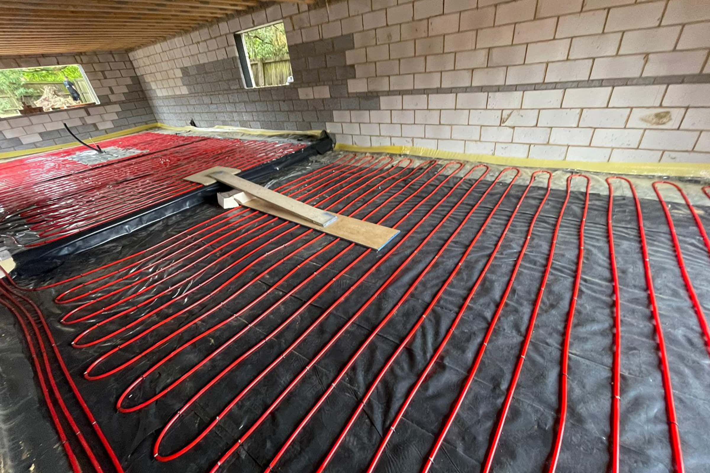 Underfloor heating pipes laid out at a new build property